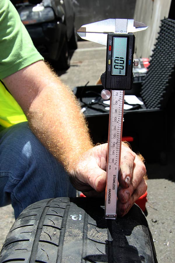 Measuring tyre tread depth using Vernier caliper on a particular tyre as part of a motor vehicle crash investigation
